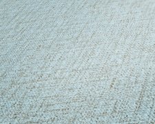 Vliesová tapeta s textilním vzorem i strukturou, kombinace tyrkysové, modré a zelené barvy. Kolekce Desert Lodge od německého výrobce tapet A.S.Création
